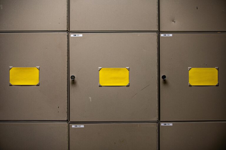 Yellow Paper on Gray Metal Cabinet